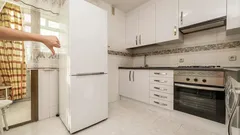 Säg hej då till den traditionella kylskåpsplaceringen: Den nya trenden är en mer estetisk och praktisk lösning för ditt kök